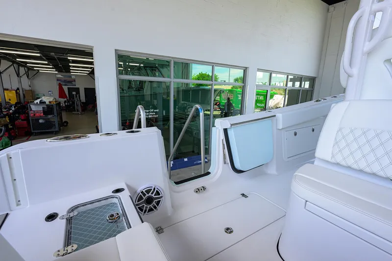 Slide: The Image of 2026 Sportsman Heritage 321 Center Console interior with white seating and modern design. - 34