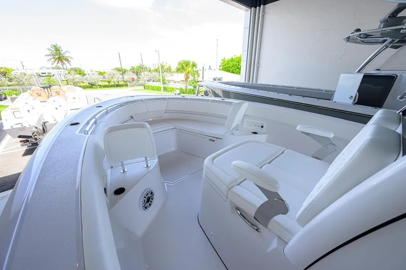 Slide: The Image of 2026 Sportsman Heritage 321 Center Console boat interior with white seating and modern design. - 6
