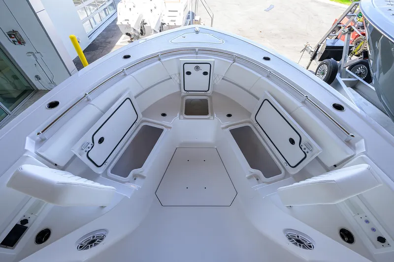 Slide: The Image of 2026 Sportsman Heritage 321 Center Console boat interior with open storage compartments. - 8