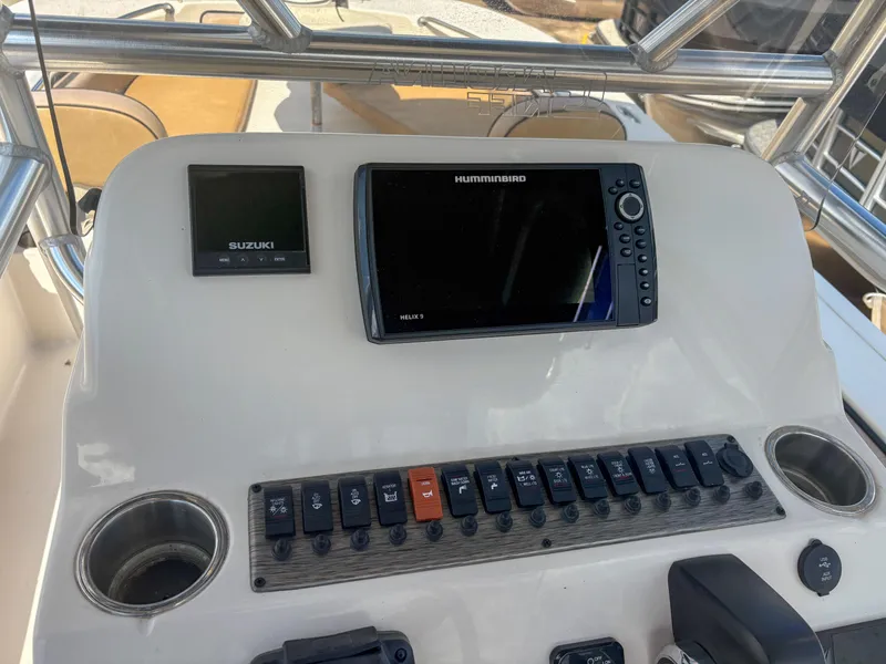 Slide: The Image of 2024 Carolina Skiff 22 Ultra Elite dashboard with Suzuki and Humminbird electronics. - 14