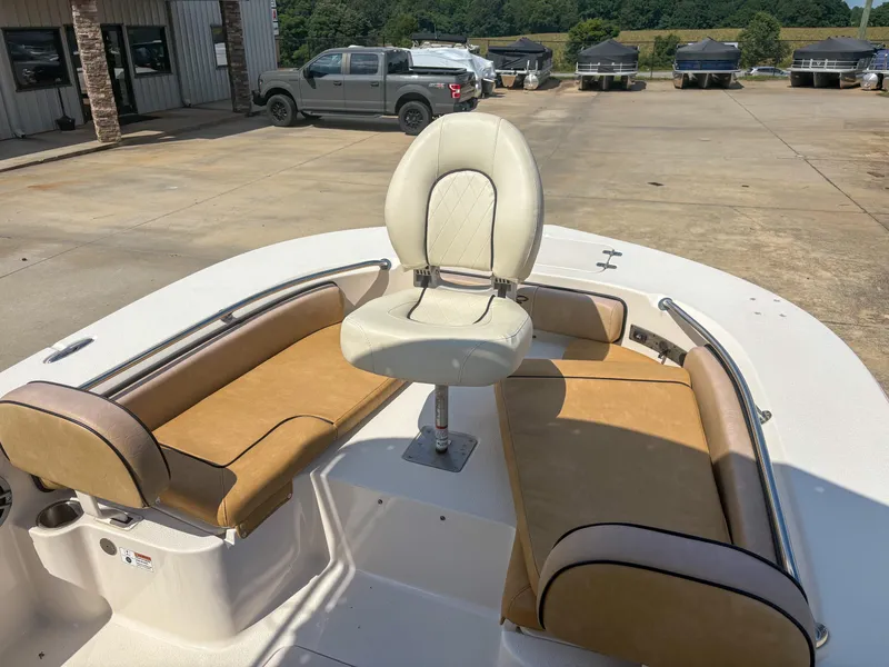 Slide: The Image of 2024 Carolina Skiff 22 Ultra Elite boat interior with seating and steering chair. - 7