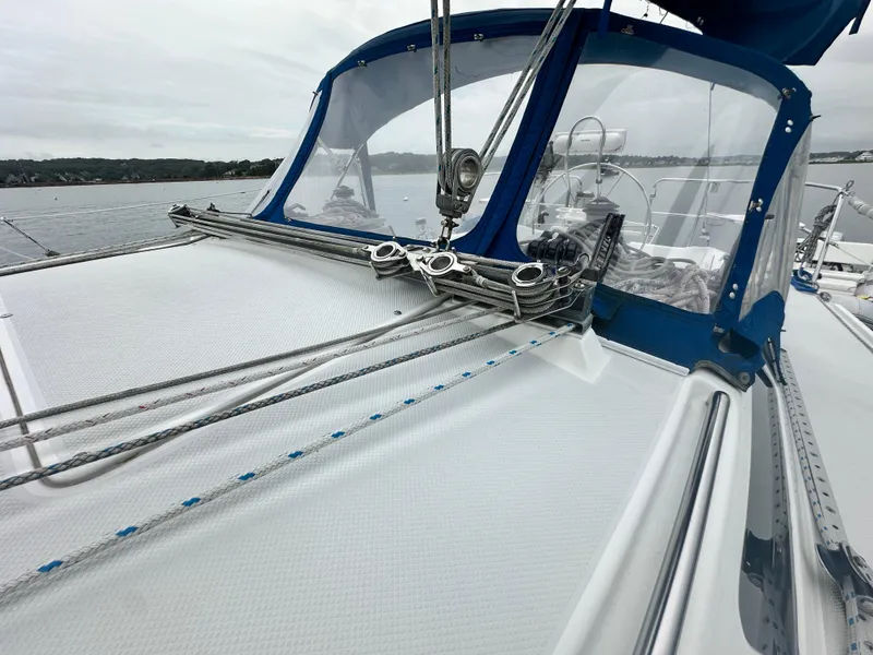 Slide: The Image of Sailboat deck of 1999 Catalina 320 with blue canopy and rigging details. - 11