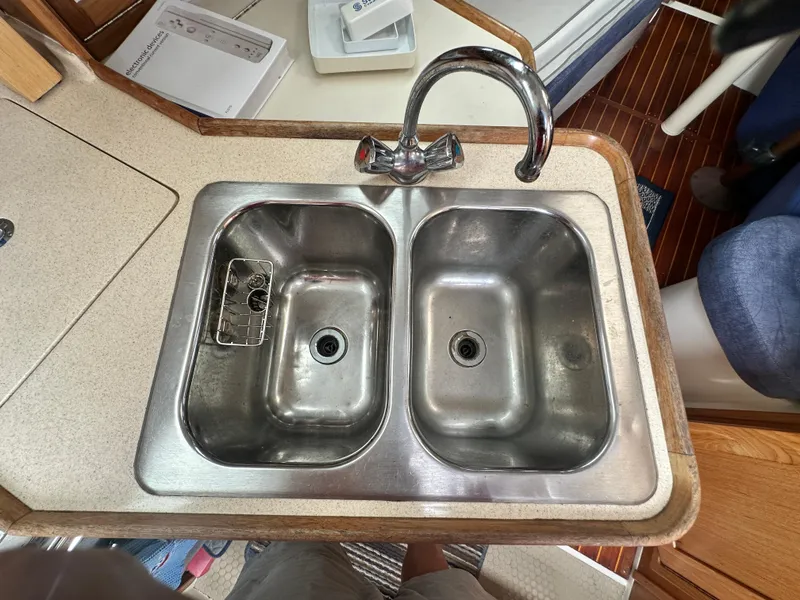 Slide: The Image of Stainless steel double sink in 1999 Catalina 320 yacht kitchen area. - 13