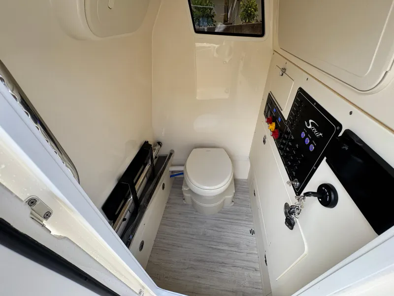 Slide: The Image of 2026 Scout 281 XSS boat interior with toilet and control panel. - 27
