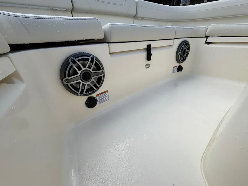 Slide: The Image of 2026 Scout 281 XSS boat interior with speakers and cushioned seating. - 29