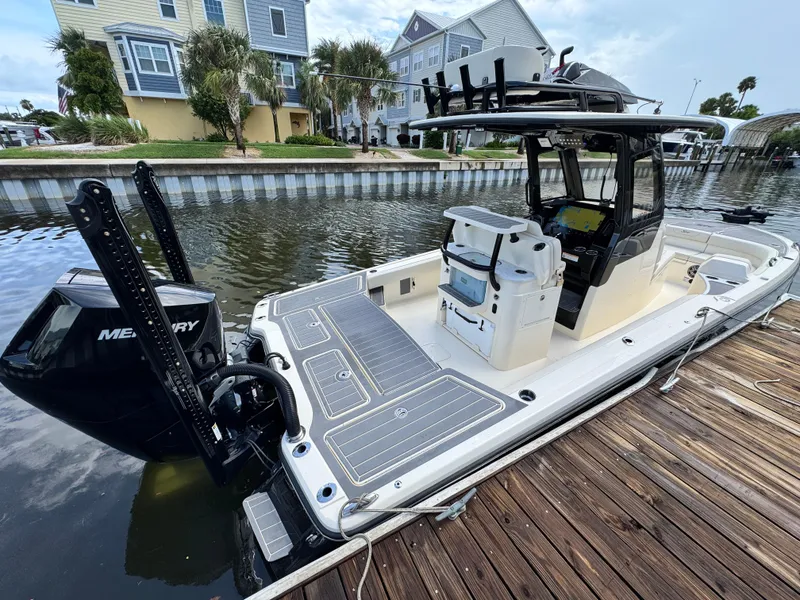 Slide: The Image of 2026 Scout 281 XSS boat docked, featuring sleek design and modern equipment. - 6