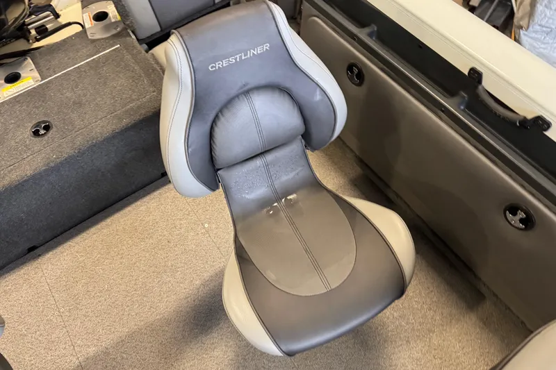 Slide: The Image of Crestliner 1850 Sportfish Outboard 2017 boat seat, gray and black upholstery, interior view. - 12