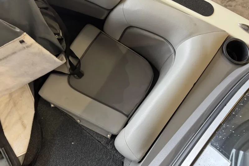 Slide: The Image of 2017 Crestliner 1850 Sportfish Outboard interior with gray seating and storage area. - 15