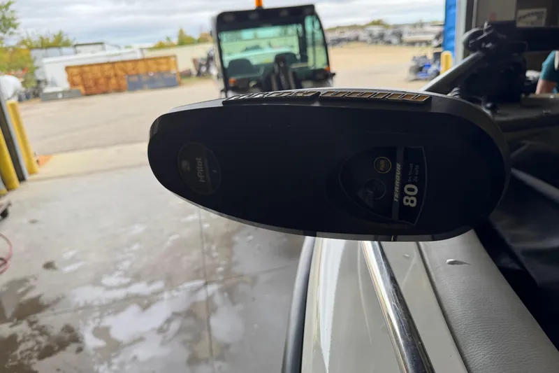 Slide: The Image of Close-up of a 2017 Crestliner 1850 Sportfish Outboard motor in a garage setting. - 17