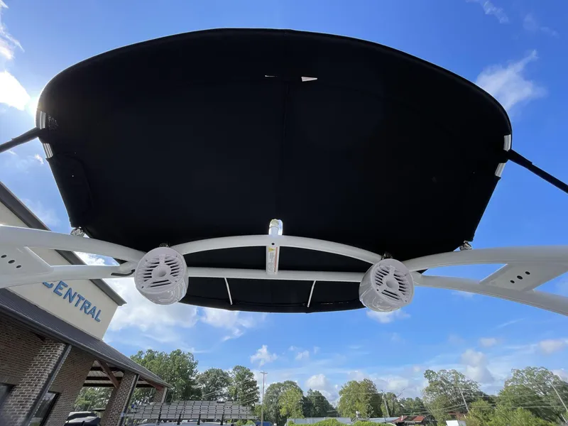 Slide: The Image of 2015 Moomba Mobius LSV boat canopy with speakers against a clear blue sky. - 18