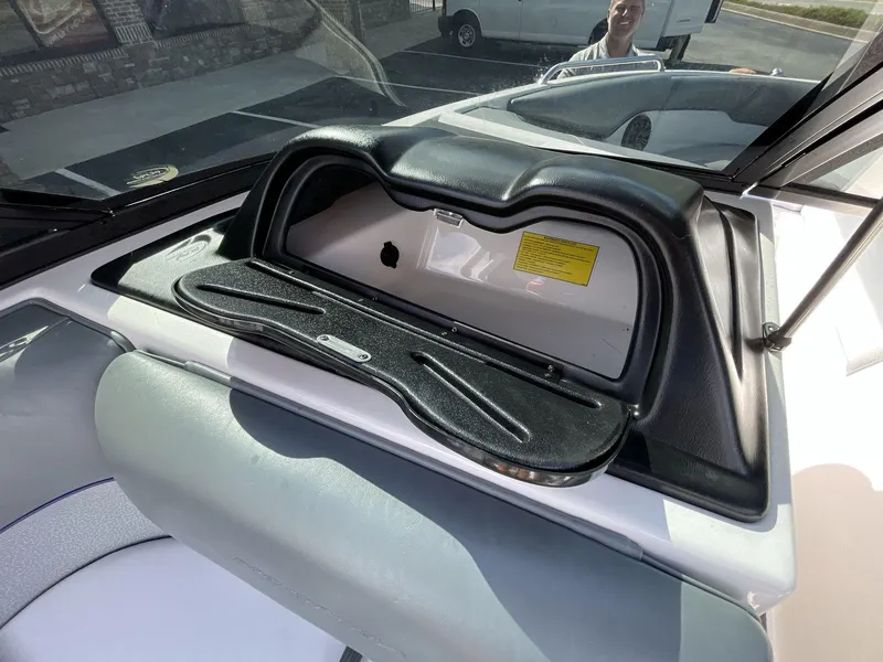 Slide: The Image of 2015 Moomba Mobius LSV dashboard with storage compartment and seating. - 19