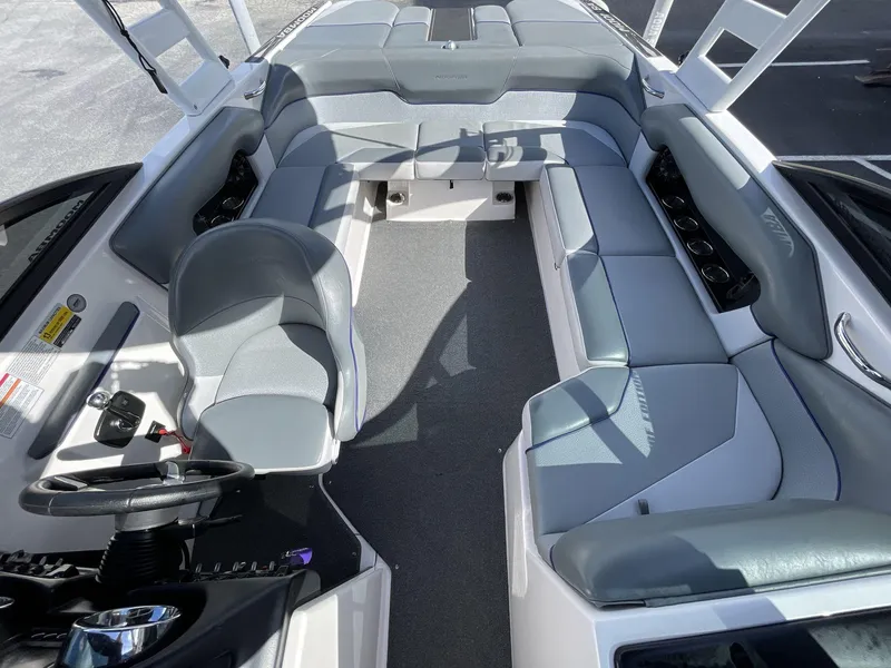 Slide: The Image of 2015 Moomba Mobius LSV interior with gray seating and steering wheel. - 20