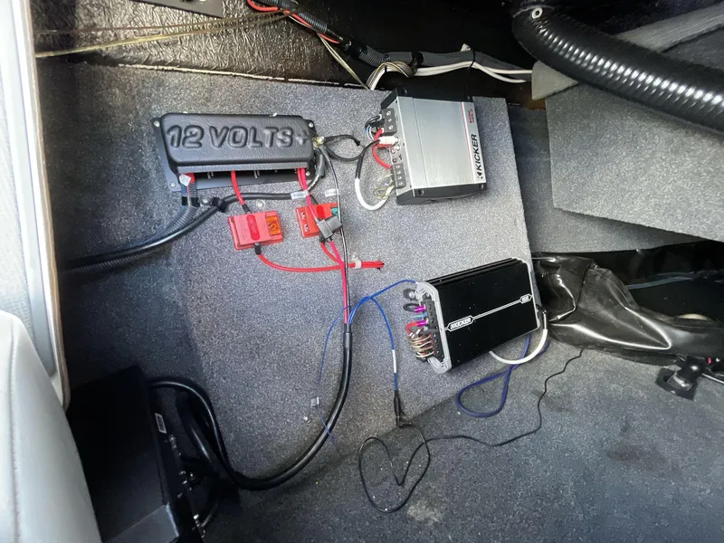 Slide: The Image of 2015 Moomba Mobius LSV boat interior showing audio system wiring and components. - 23