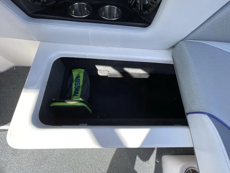 Slide: The Image of 2015 Moomba Mobius LSV boat storage compartment with a Mission bag inside. - 24