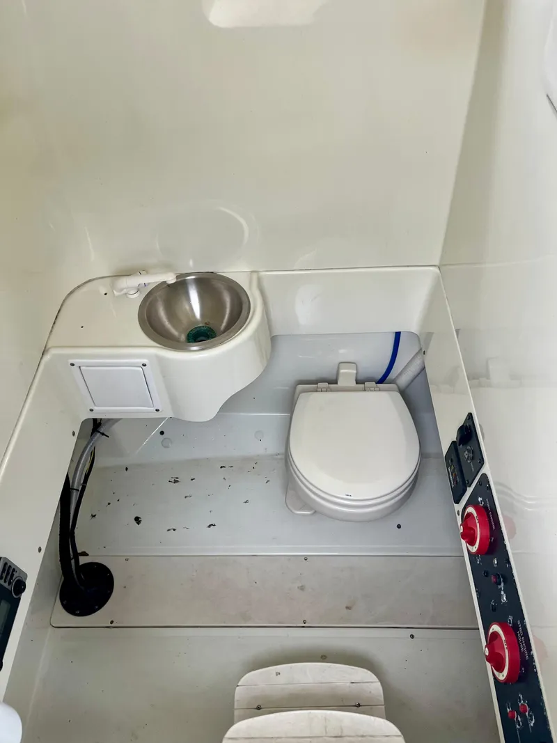 Slide: The Image of 2006 Hydra-Sports Vector 2900 CC boat interior with toilet and sink. - 11