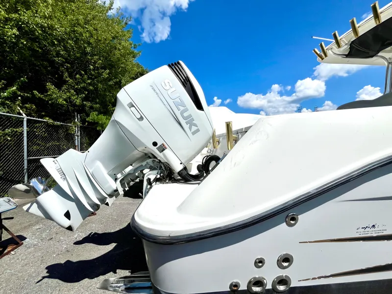 Slide: The Image of 2006 Hydra-Sports Vector 2900 CC with Suzuki outboard motor under clear blue sky. - 13