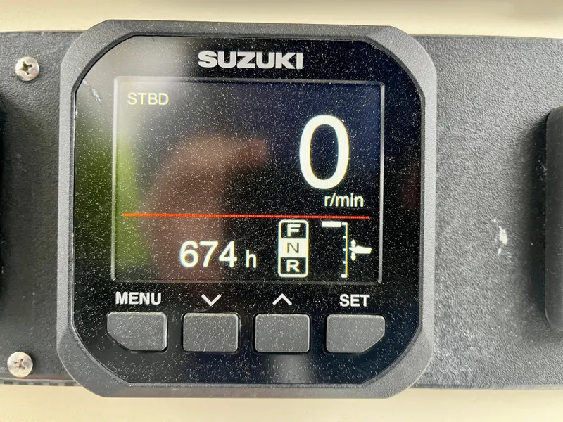 Slide: The Image of Suzuki digital display showing 674 hours on a 2006 Hydra-Sports Vector 2900 CC boat. - 18
