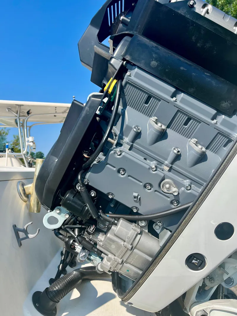 Slide: The Image of 2006 Hydra-Sports Vector 2900 CC boat engine close-up under clear blue sky. - 30