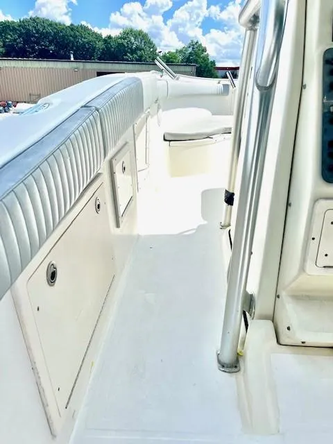 Slide: The Image of 2006 Hydra-Sports Vector 2900 CC boat interior with white seating and storage compartments. - 6