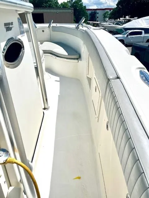 Slide: The Image of 2006 Hydra-Sports Vector 2900 CC boat interior with cushioned seating and storage compartments. - 7