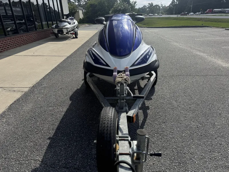 Slide: The Image of 2003 Yamaha WaveRunner FX140 on trailer in parking lot. - 7