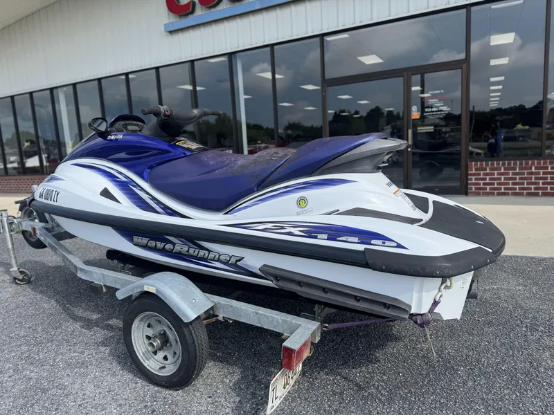 Slide: The Image of 2003 Yamaha WaveRunner FX140 on trailer outside a store. - 2