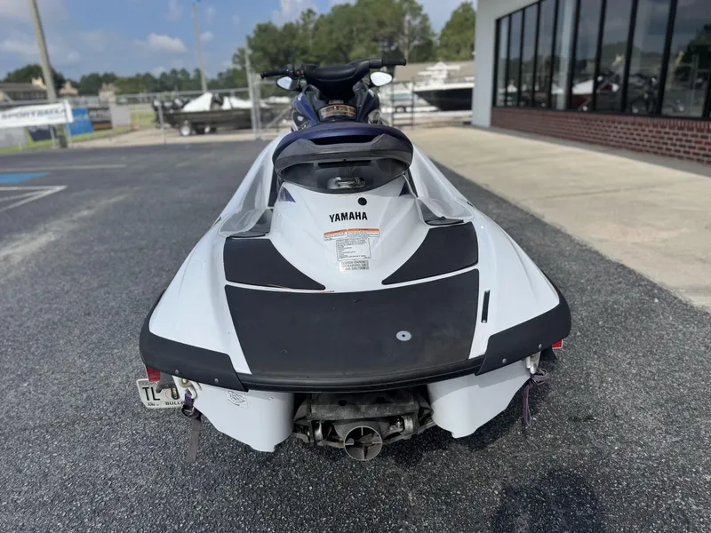 Slide: The Image of 2003 Yamaha WaveRunner FX140 jet ski parked outdoors, rear view. - 3