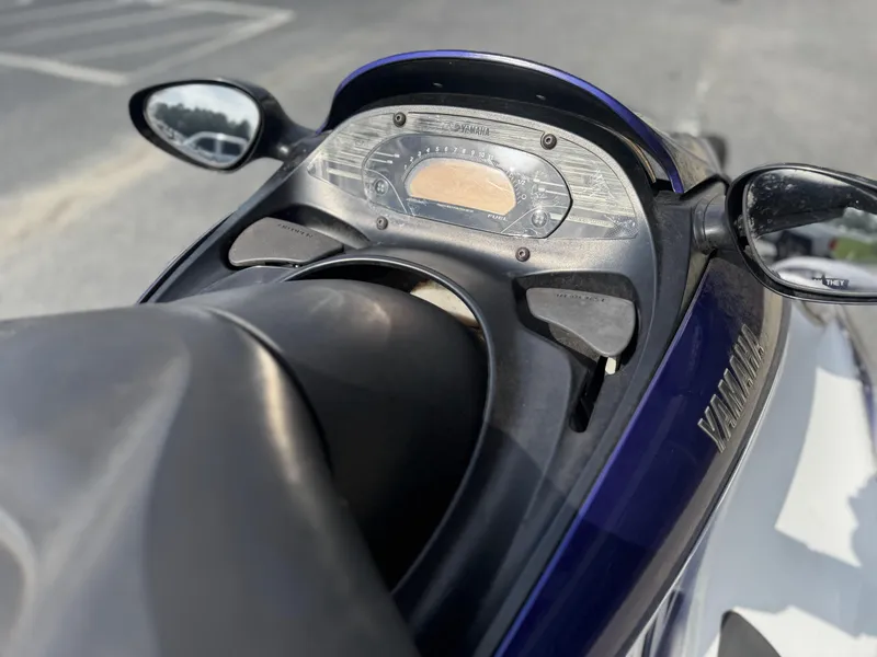 Slide: The Image of 2003 Yamaha WaveRunner FX140 dashboard with mirrors and controls in focus. - 4