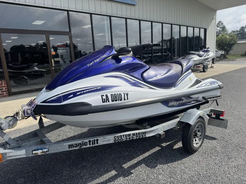 Slide: The Image of 2003 Yamaha WaveRunner FX140 on trailer outside a marine shop. - 6