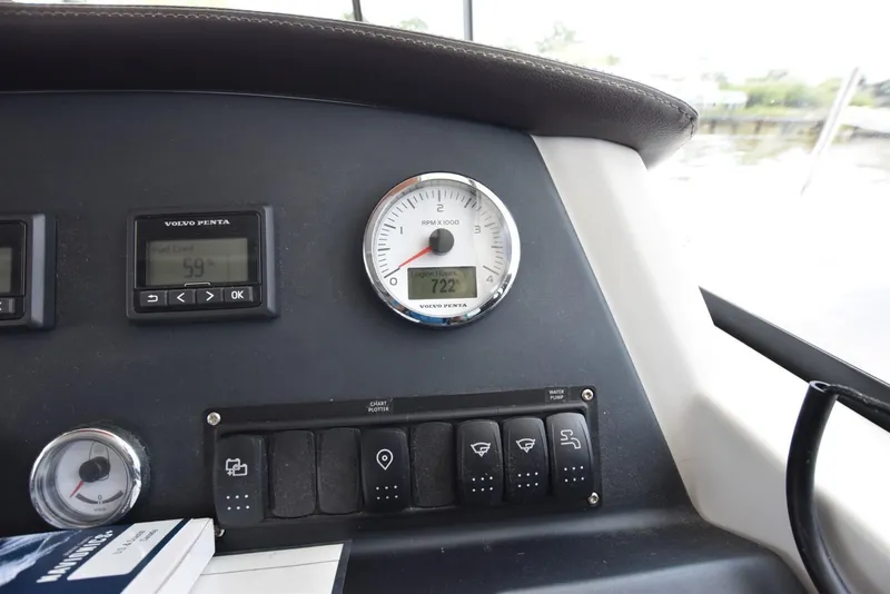 Slide: The Image of Control panel of 2019 Beneteau Swift Trawler 44 with Volvo Penta gauges and switches. - 10