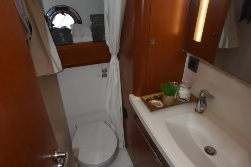 Slide: The Image of Bathroom interior of 2019 Beneteau Swift Trawler 44 with sink and toilet. - 28