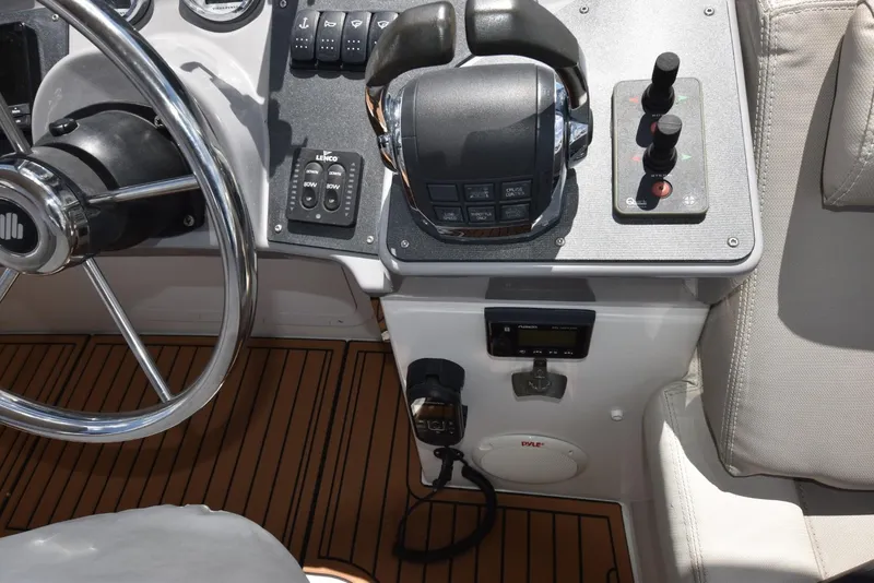 Slide: The Image of Helm of 2019 Beneteau Swift Trawler 44 with steering wheel and control panel. - 41