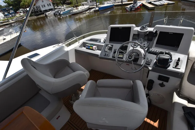 Slide: The Image of Helm of 2019 Beneteau Swift Trawler 44 with dual screens and steering wheel. - 45