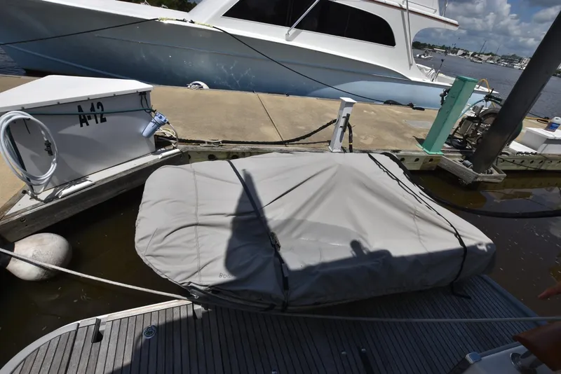 Slide: The Image of Docked 2019 Beneteau Swift Trawler 44 with covered equipment, marina setting. - 47