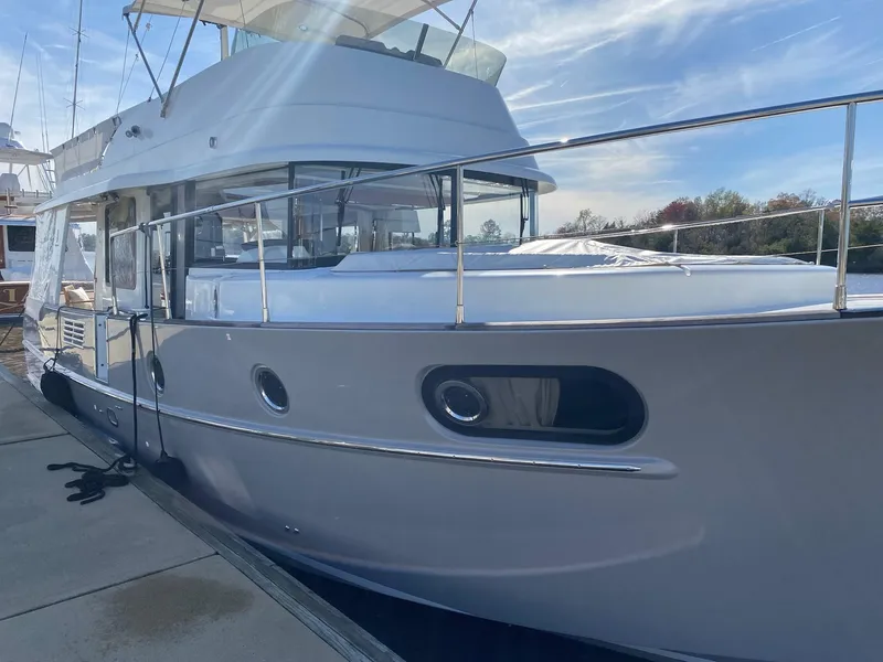 Slide: The Image of 2019 Beneteau Swift Trawler 44 docked, showcasing sleek design and modern features. - 5