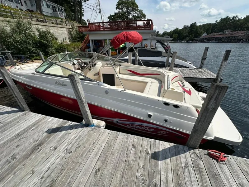 Slide: The Image of 2005 Rinker 282 Captiva Bowrider docked by a wooden pier on a sunny day. - 6