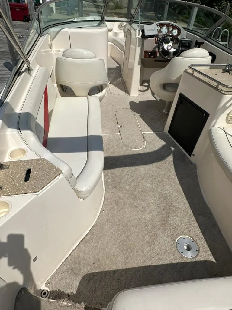 Slide: The Image of 2005 Rinker 282 Captiva Bowrider interior with seating and steering wheel. - 9