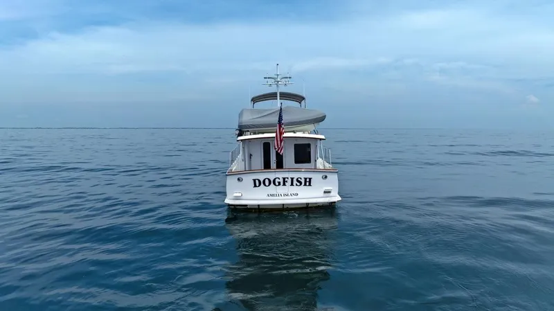 Slide: The Image of Krogen Express 52 yacht "Dogfish" on calm ocean waters, 2023 model. - 18