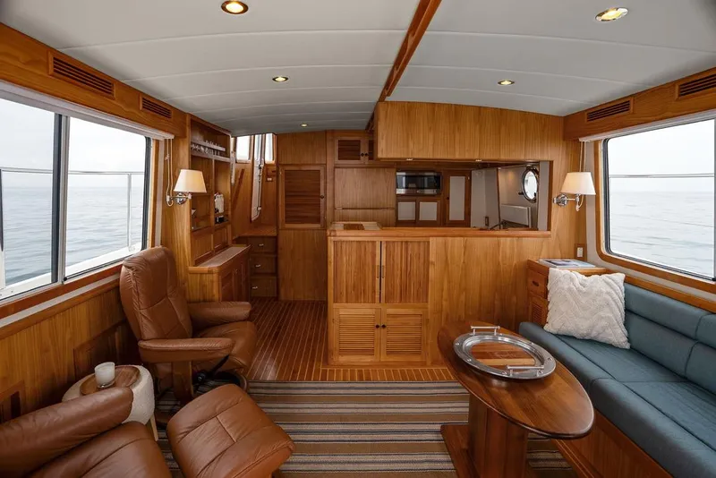 Slide: The Image of Luxurious interior of 2023 Krogen Express 52 yacht with wood paneling and comfortable seating. - 31