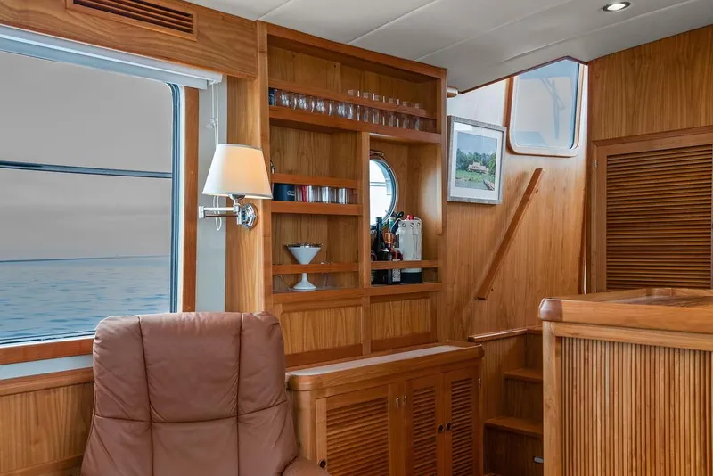 Slide: The Image of Luxurious interior of 2023 Krogen Express 52 yacht with wooden finishes and ocean view. - 35