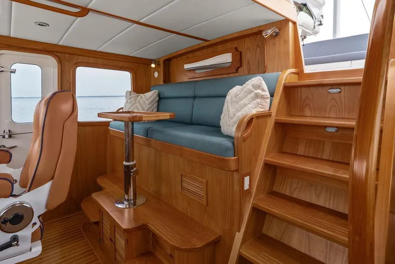 Slide: The Image of Luxurious interior of 2023 Krogen Express 52 yacht with wooden finish and plush seating. - 45
