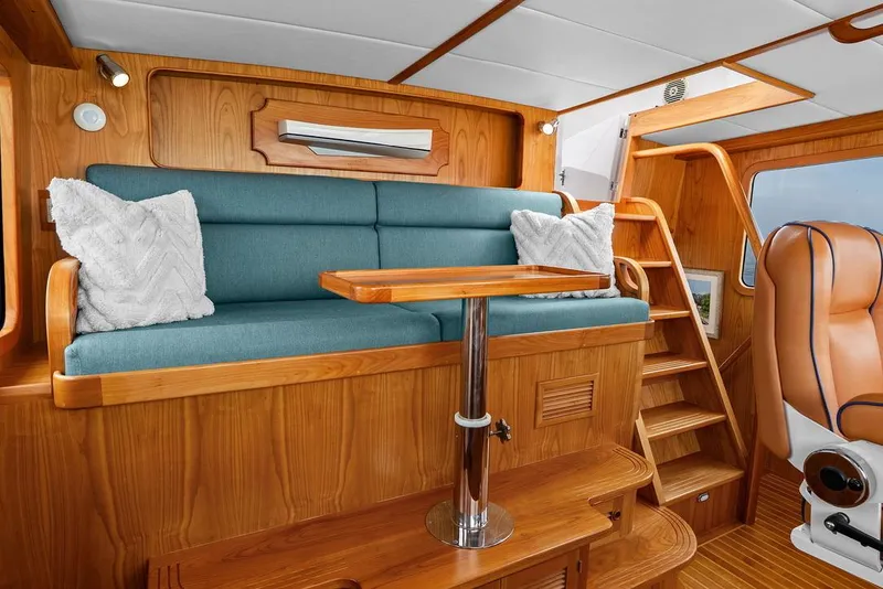 Slide: The Image of Luxurious interior of 2023 Krogen Express 52 yacht with wooden finish and blue seating. - 47