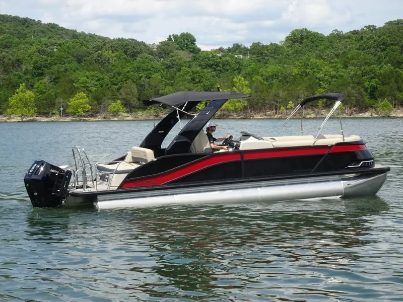 Slide: The Image of 2025 Harris Grand Mariner 250 pontoon boat on a scenic lake. - 1