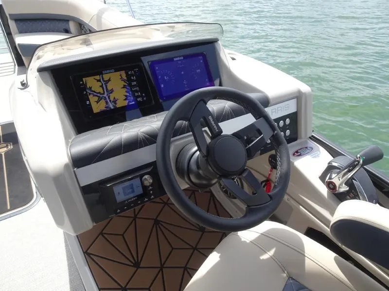 Slide: The Image of 2025 Harris Grand Mariner 250 helm with advanced navigation displays and controls. - 12