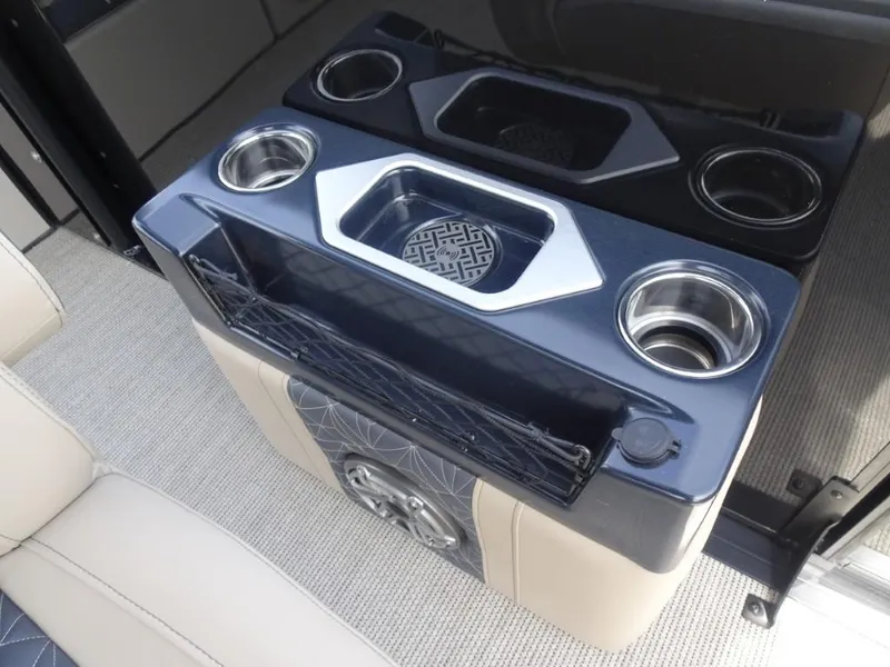 Slide: The Image of Interior of 2025 Harris Grand Mariner 250 with cup holders and storage compartments. - 16