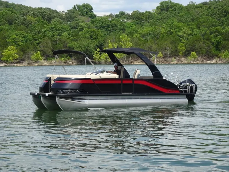 Slide: The Image of 2025 Harris Grand Mariner 250 pontoon boat on a scenic lake. - 5