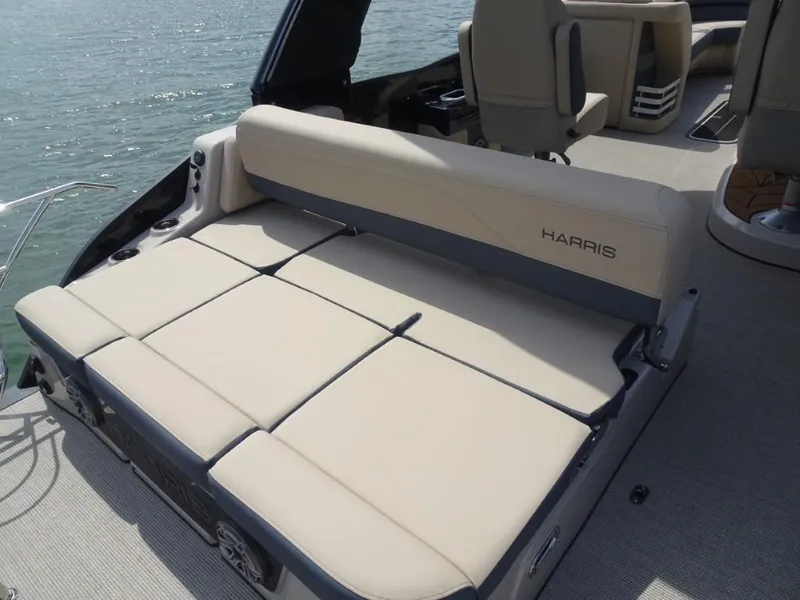 Slide: The Image of 2025 Harris Grand Mariner 250 boat with luxurious seating on a sunny day. - 8