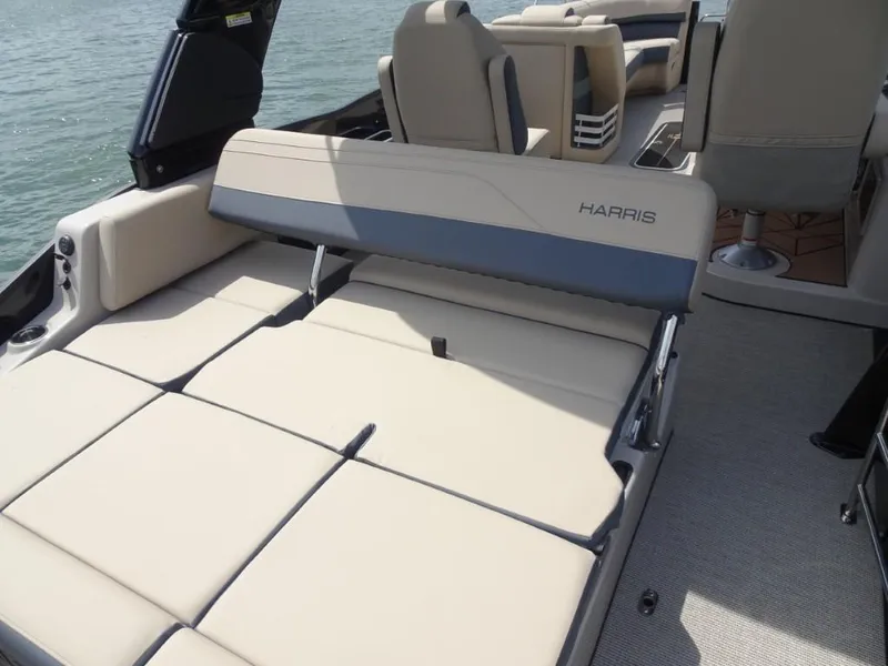 Slide: The Image of 2025 Harris Grand Mariner 250 boat interior with beige seating and adjustable backrest. - 9