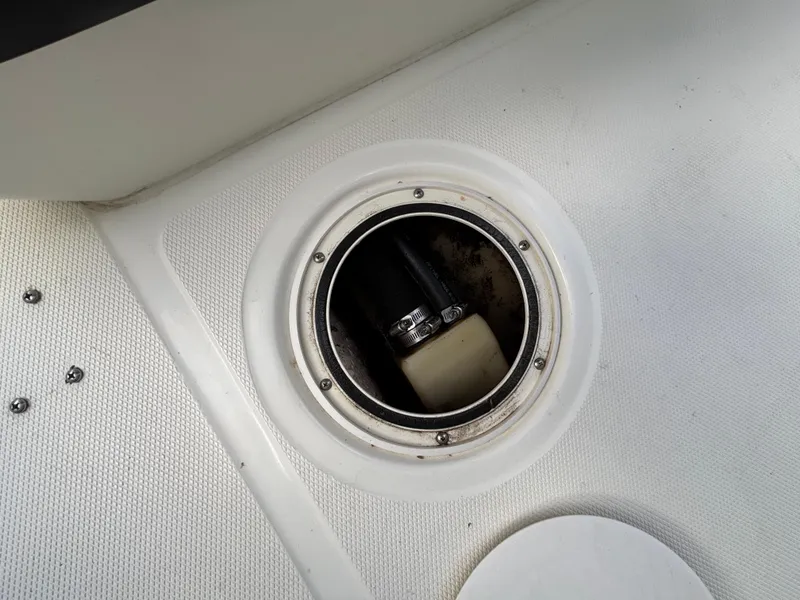 Slide: The Image of Inspection hatch on 2004 Triton LTS boat deck, showing internal components. - 20