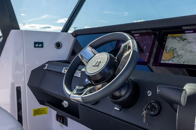 Slide: The Image of 2026 Axopar AX29 CCX boat on calm water, aerial view. - 14